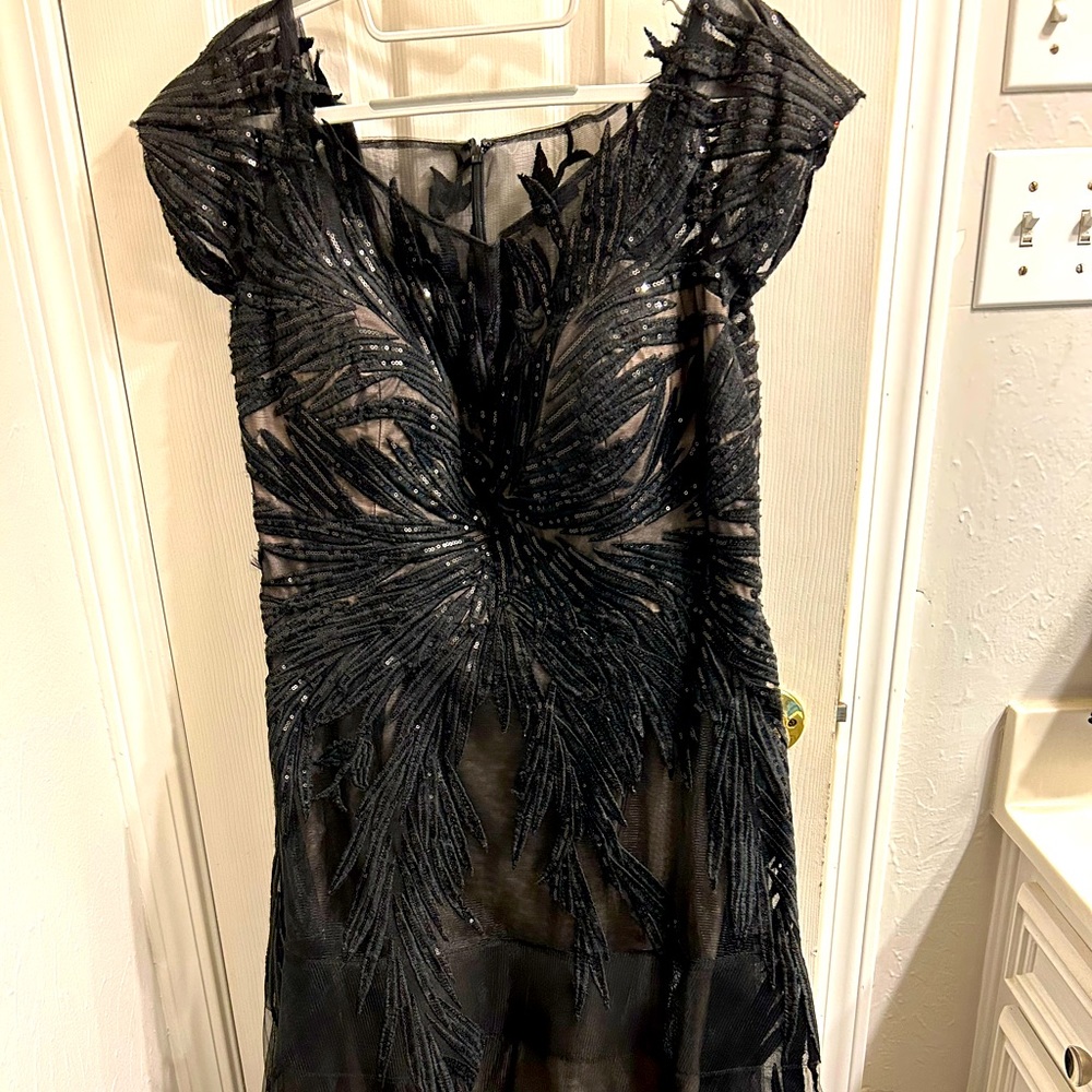 Black formal with sequined appliqués